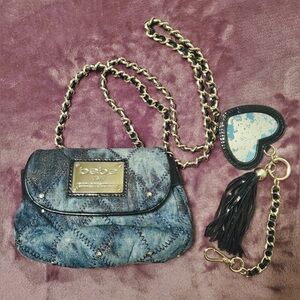 Bebe denim mini crossbody bag with mirror keychain.